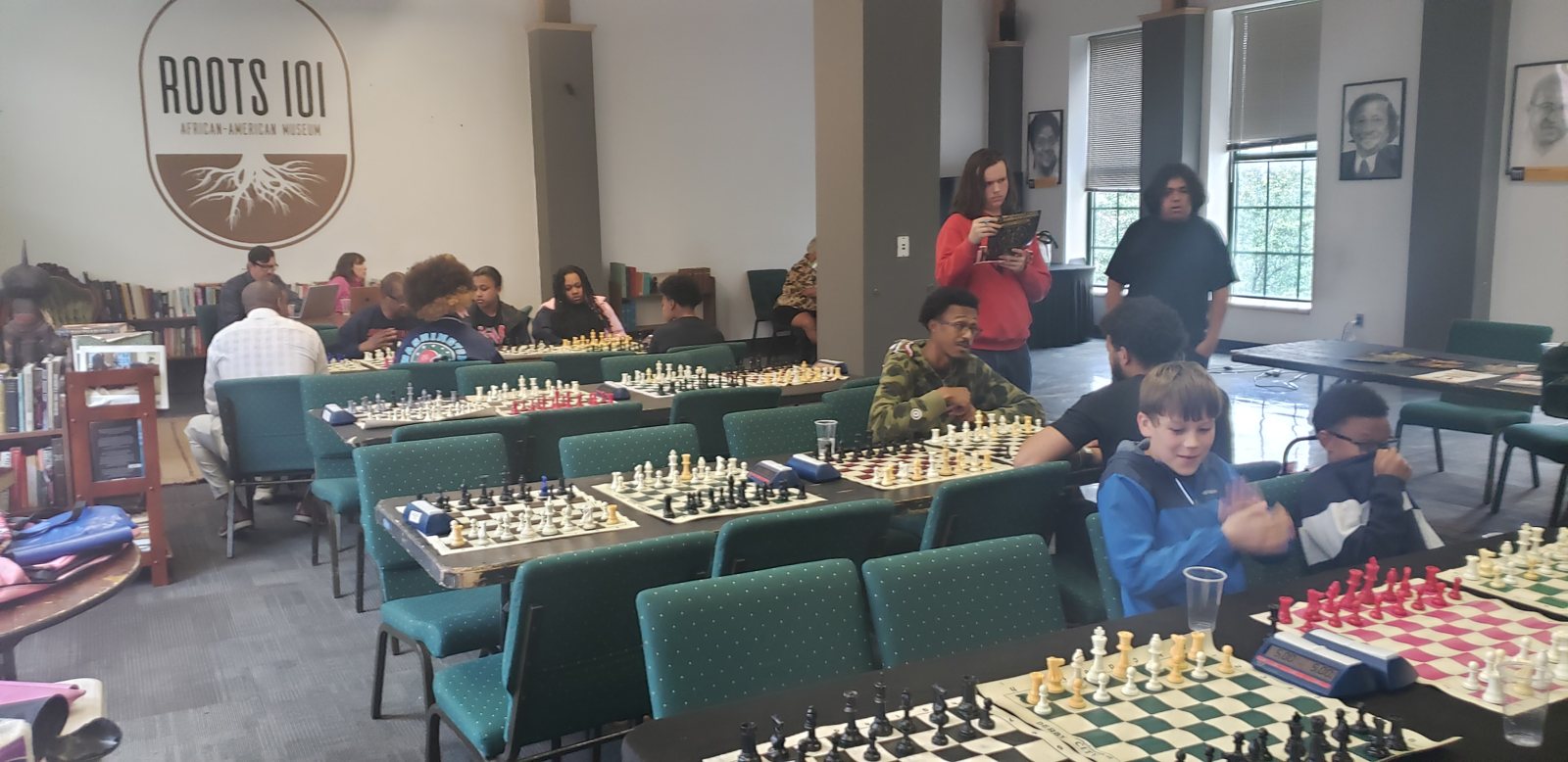 The room at Roots 101 filled with boards and players, Butch Mosby Chess Classic 2 at Roots 101 African American Museum, Louisville