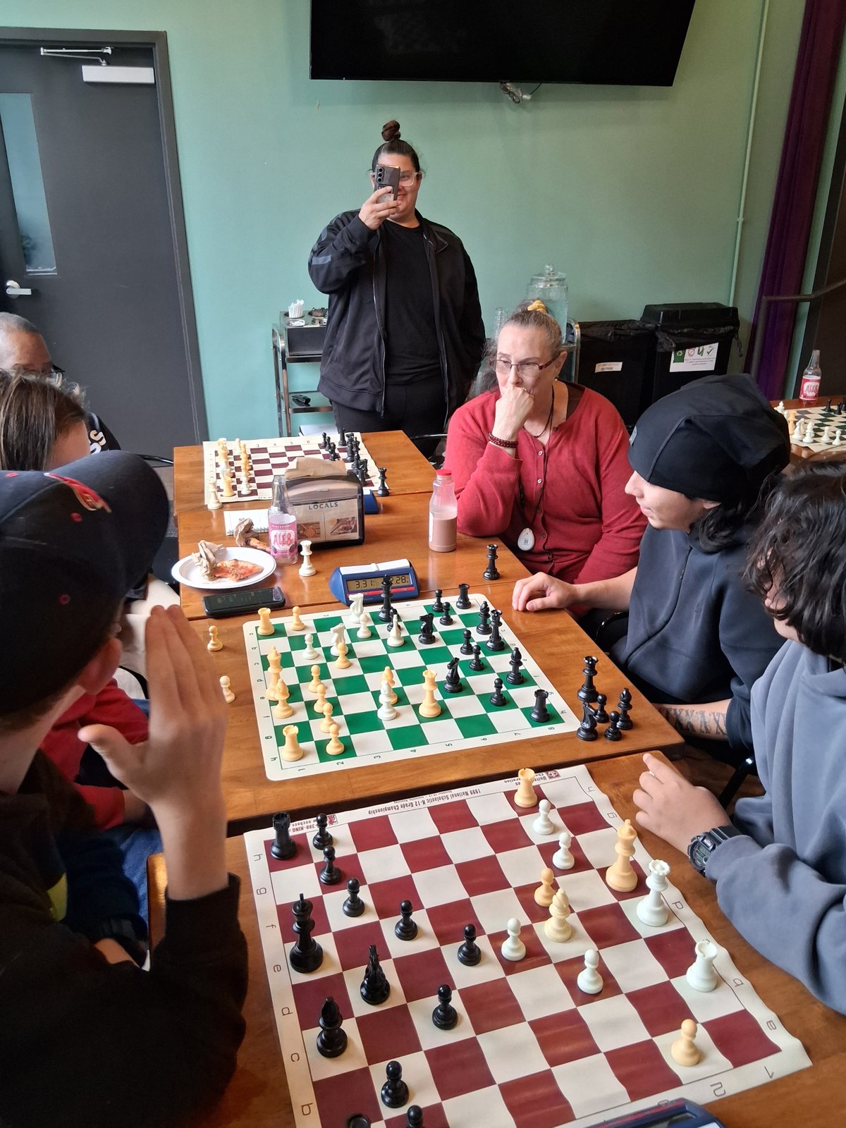 Three games going at once, youth chess tournament at Locals in Louisville