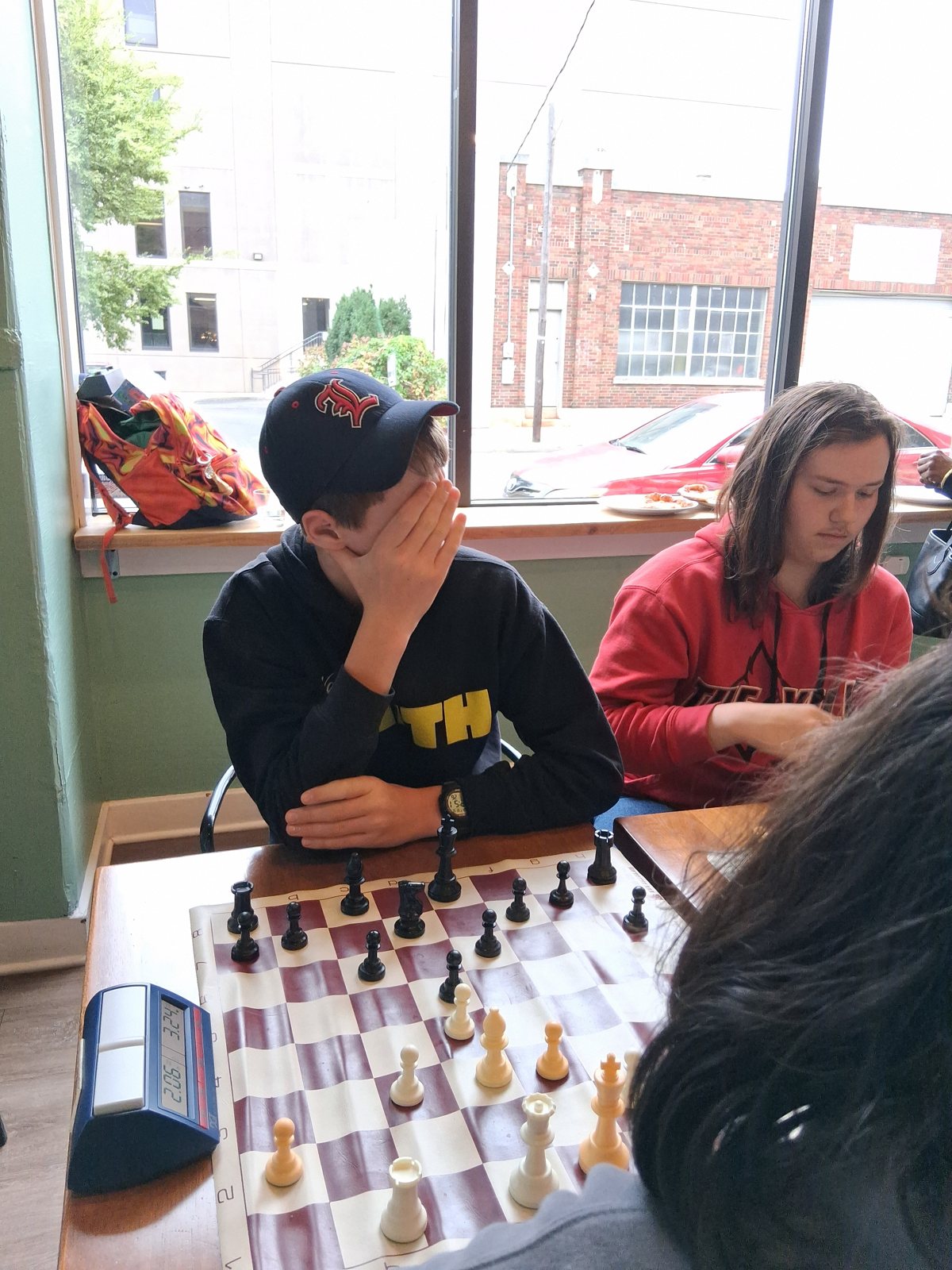 Deep in thought at the board, youth chess tournament at Locals in Louisville