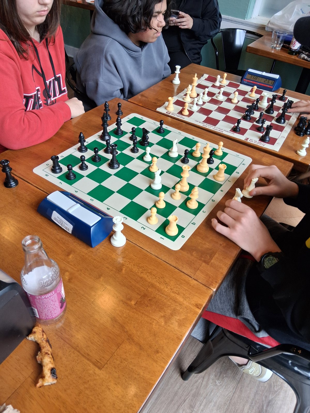 Clocks running, pieces flying, youth chess tournament at Locals in Louisville